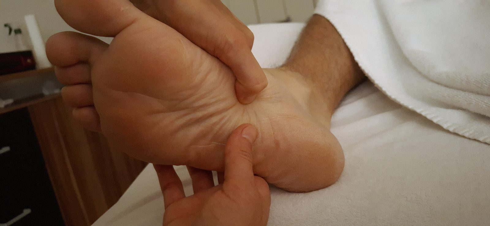 Fußreflexzonenmassage an der Fußsohle